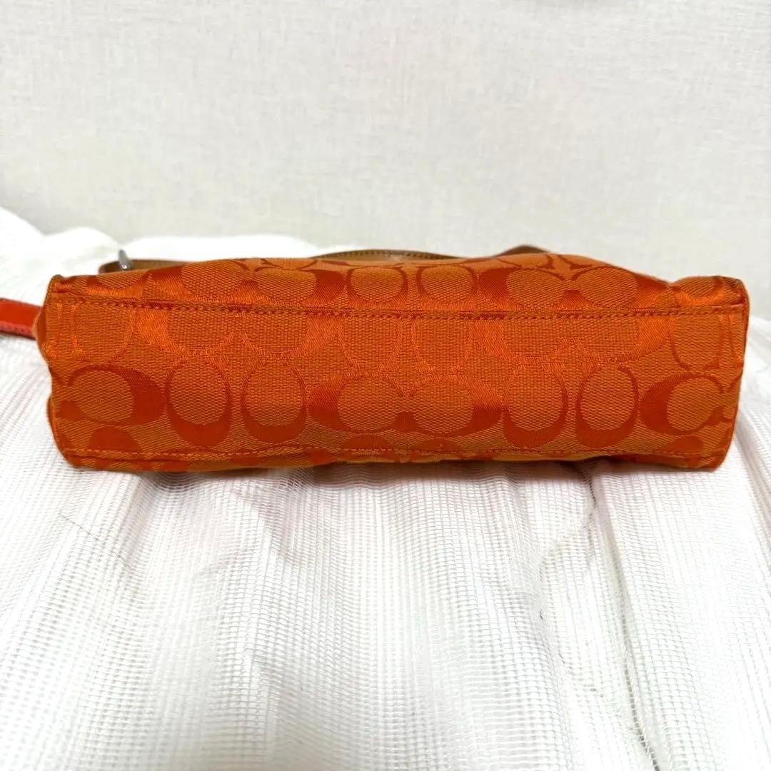 COACH アクセサリーポーチ　ワンショルダー　シグネチャー　オレンジ