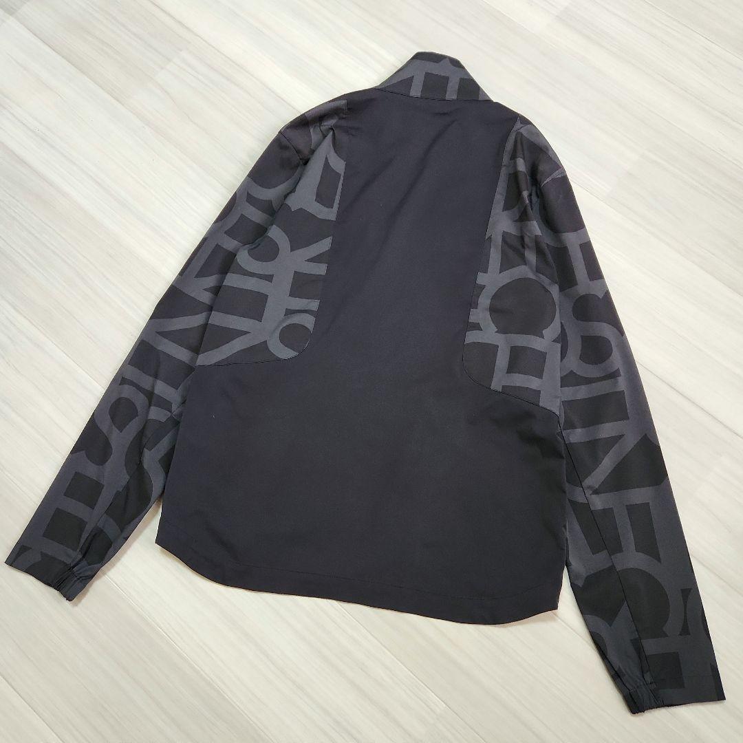 DESCENTE GOLFタイポグラフィモチーフウィンドジャケットストレッチM黒