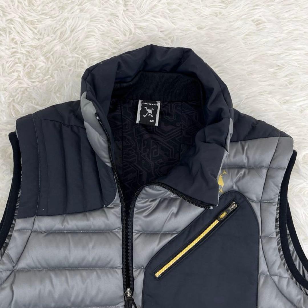 【美品】オークリー・ゴルフウェア・ダウンベスト・アシンメトリー・ロゴプリント・M