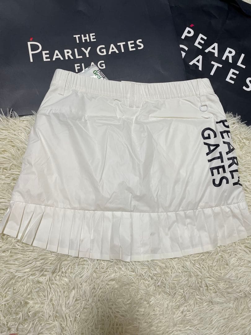 パーリーゲイツ 【軽量保温】バックロゴプリーツ切替タフタスカートサイズ2