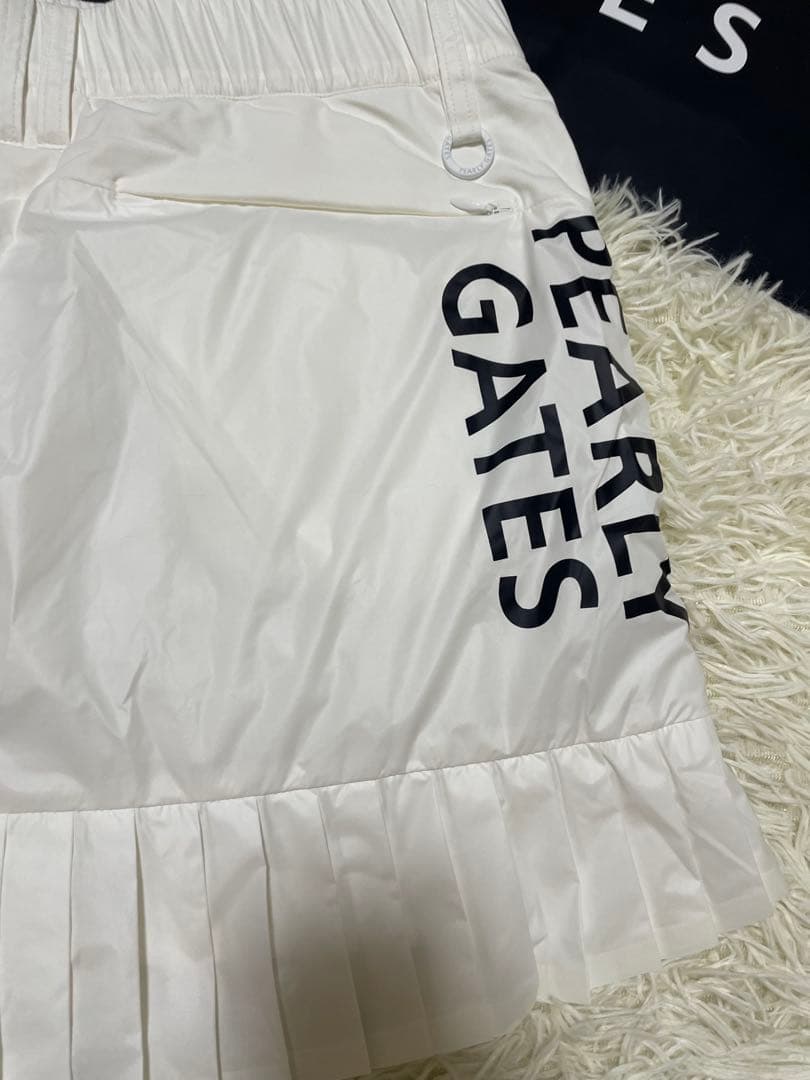 パーリーゲイツ 【軽量保温】バックロゴプリーツ切替タフタスカートサイズ2