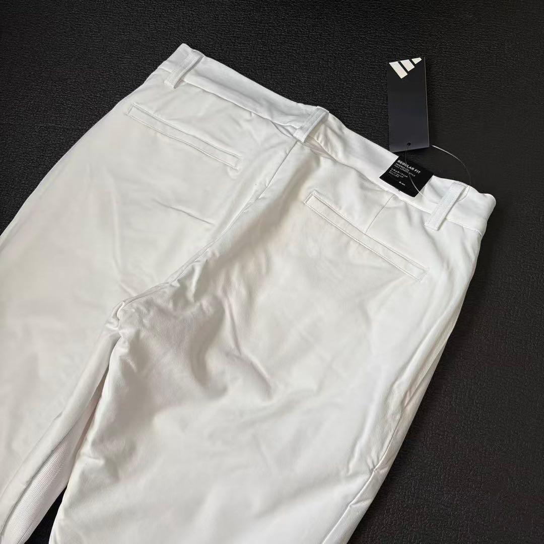 82cm新品27500円アディダスゴルフ/メンズ/秋冬/中綿ストレッチパンツ/白